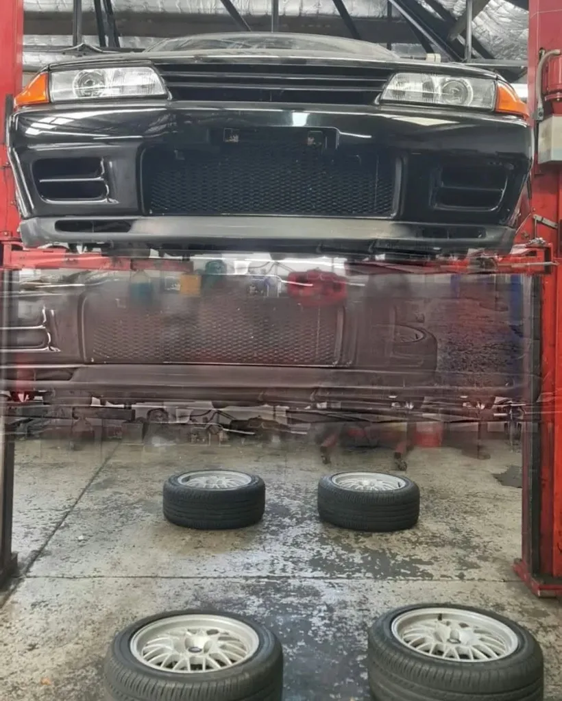 Underbody inspection of a vehicle raised on a hoist